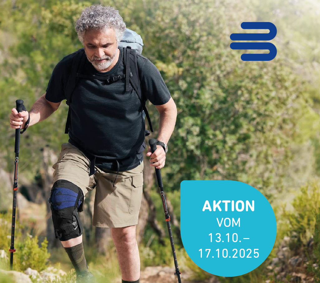 Auf dem Foto sieht man einen Mann beim Wandern, der die neue Knie-Orthese GenuTrain® OA von Bauerfeind trägt.